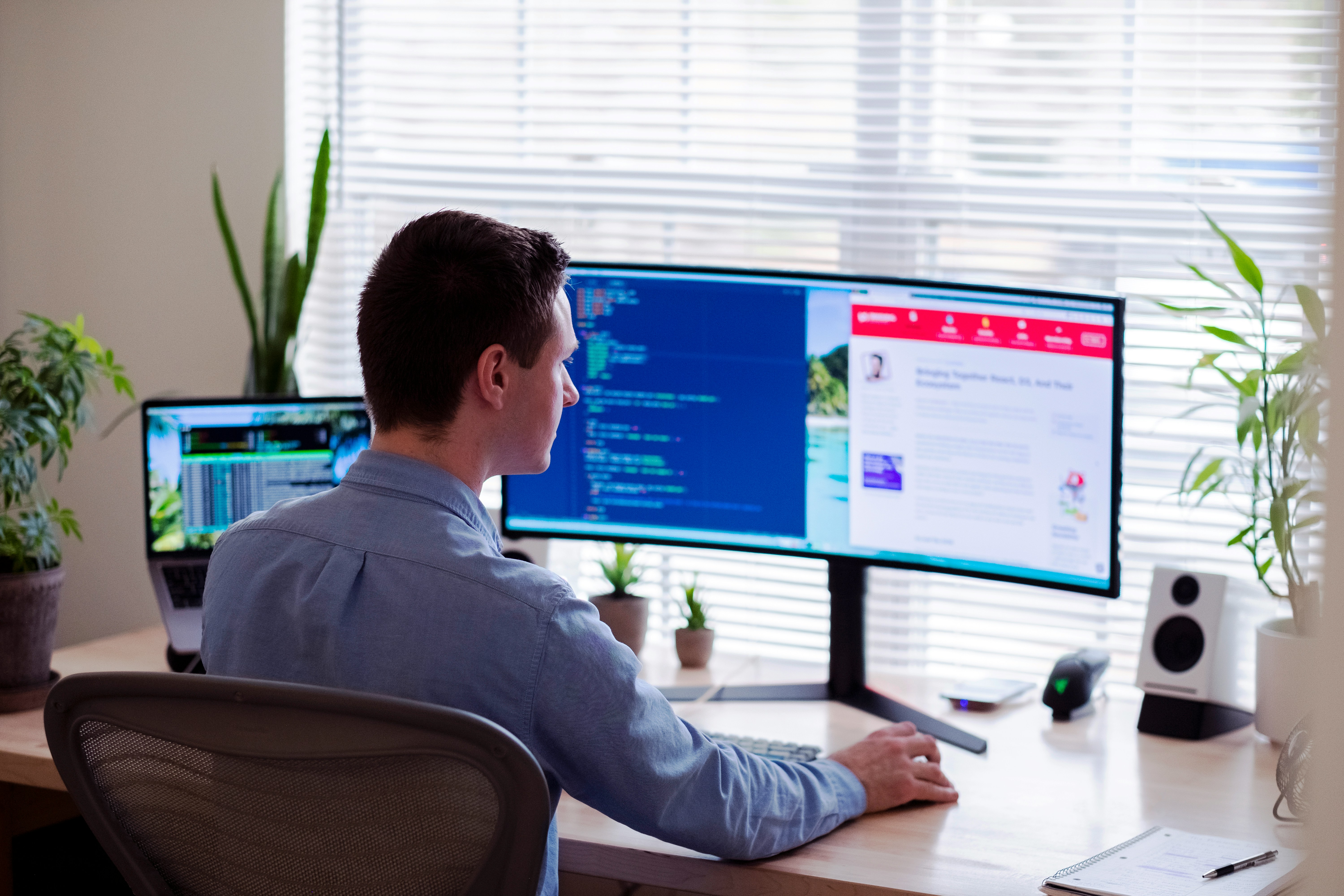 A man at his desk building a website